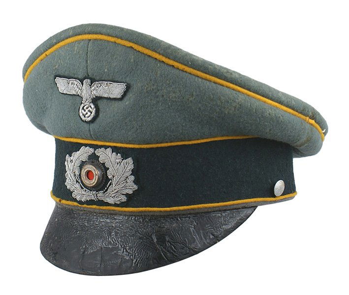German WWII Cavalry officer peaked cap: E-100 German WWII Cavalry officer peaked cap. Yellow-gold piped crown and dark green band. Surface of the black leather brim shows creases. Embroidered silver bullion eagle/swastika and wreath/metal r