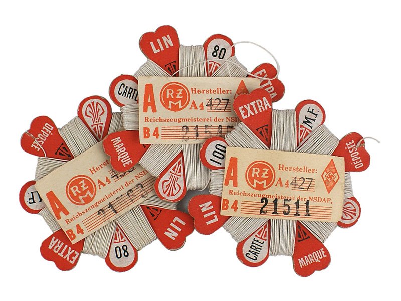 Three unused German WWII thread cards: F-110 Three unused German WWII thread cards. Maker marked each with 120 cm of wound white thread and an HJ "RZM" label. I