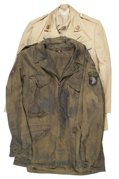 U.S. WWII uniform lot USMC: F-135 U.S. WWII uniform lot: (1) Tan USMC two-pocket shirt. One small moth spot. (2) Summer tan Engineer's four-pocket tunic. "US" and castle collar discs. Size 40. (3) M1943 field jacket with a later