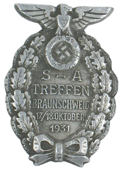 German WWII SA Brunswick Badge of Honor: B-33 German WWII SA Brunswick 1931 Rally Badge of Honor. Shield with eagle/swastika and "S-A TREFEN BRAUNSCHWEIG...1931". Solid type-marked "RZM M1/63". II