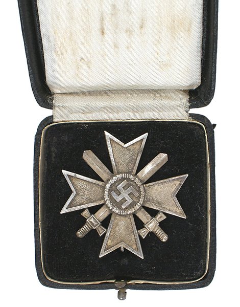 German WWII War Merit Cross 1st Class Swords: B-116 German WWII War Merit Cross-1st Class with Swords. Silver stippled arms of cross with "polished" silver borders. Wide vertical pin on reverse-marked "L15" (firm of Friedrich Orth in Vienna). Dar