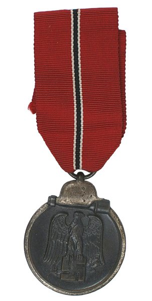 German WWII Eastern Front Medal: B-144 German WWII Eastern Front Medal. Darkened finish on a silvered perimeter with a helmet/stick grenade. Obverse bears a relief black-gray eagle/swastika. II