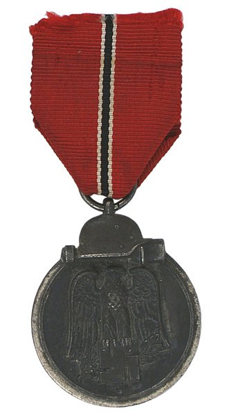 German WWII Eastern Front Medal: B-146 German WWII Eastern Front Medal. Darkened finish on a silvered perimeter with a helmet/stick grenade. Obverse bears a relief black-gray eagle/swastika. Ring stamped "8" (firm of Ferdinand Hoffst