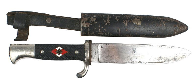 German WWII Hitler Youth knife dagger: D-26 German WWII HJ (Hitler Youth) knife dagger. Unmarked graying blade with a nick in the cutting edge. 75% black finish remains on the scabbard. Snap-button missing on retaining strap. II-