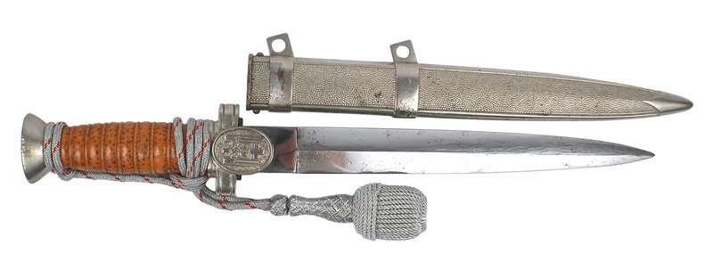 German WWII Social Welfare Leader dagger: D-30 German WWII Social Welfare Leader dagger. Nickeled, rounded flat top pommel and crossguard/langet bearing a relief eagle/swastika/red cross (was cleaned). 9 7/8" blade which has some pitting and 