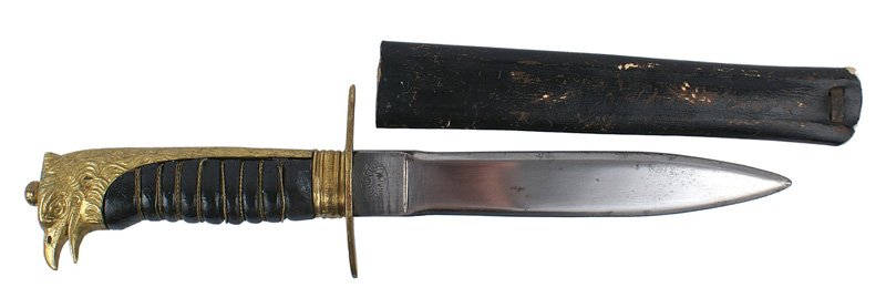 Italian Fascist Youth dagger: D-35 Italian Fascist Youth dagger. Gilt brass feathered backstrap/open-beak eagle head pommel and crossguard. Wire wrapped black wood grip. 6 7/8" clean blade marked "SCOUT TO NAPOLI". Rigid black lea