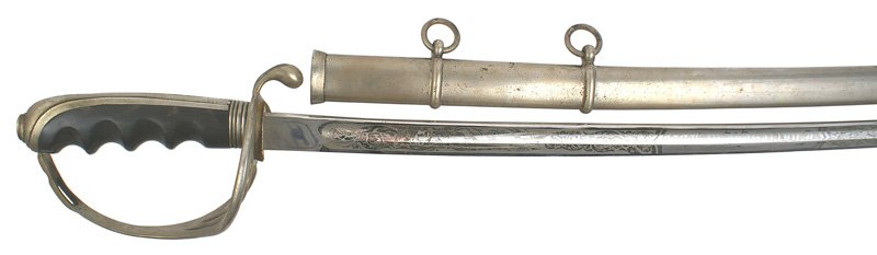 U.S. M1902 officer dress sword: D-87 U.S. M1902 officer's dress sword. Nickeled backstrap/pommel and three-branch guard. Finger grooved black wood grip. Clean 31 3/4" blade etched with military/floral motifs and name of owner "Charl