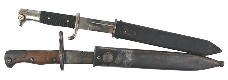 Lot of 2 German bayonets Mauser etc: D-90 Lot of two German bayonets: (1) 98/05-modified by the Israelis. Plain wood grips, saw-back on spine "taken down", "WAFFENFABRIK MAUSER" markings partially discernible and replaced crossguard with