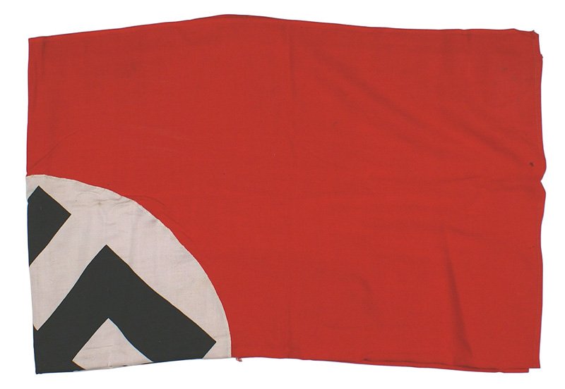 German WWII NSDAP flag: H-81 German WWII NSDAP flag. Black printed swastika on a white disc sewn to a red field. 32" x 48". Several small tears-otherwise in good condition. II-