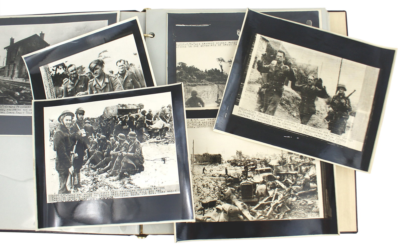 34 WWII US press photos Normandy: L-012 Lot of 34 WWII U.S. 7" x 8 1/2" press photos (copies). Thirty-one are related to the Normandy Invasion and the drive inland. Included are Eisenhower speaking to U.S. paratroopers, Invasion, beac