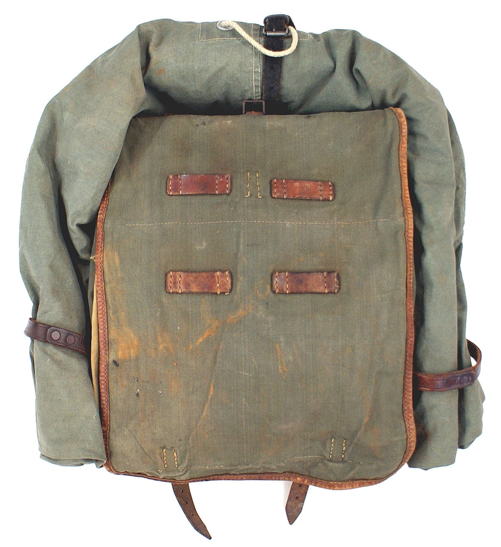 German WWII SA back pack: N-002 SA pack with pony hide backing, shoulder strap, OD shelter quarter attached to pack with proper leather straps. Shows some usage. About II