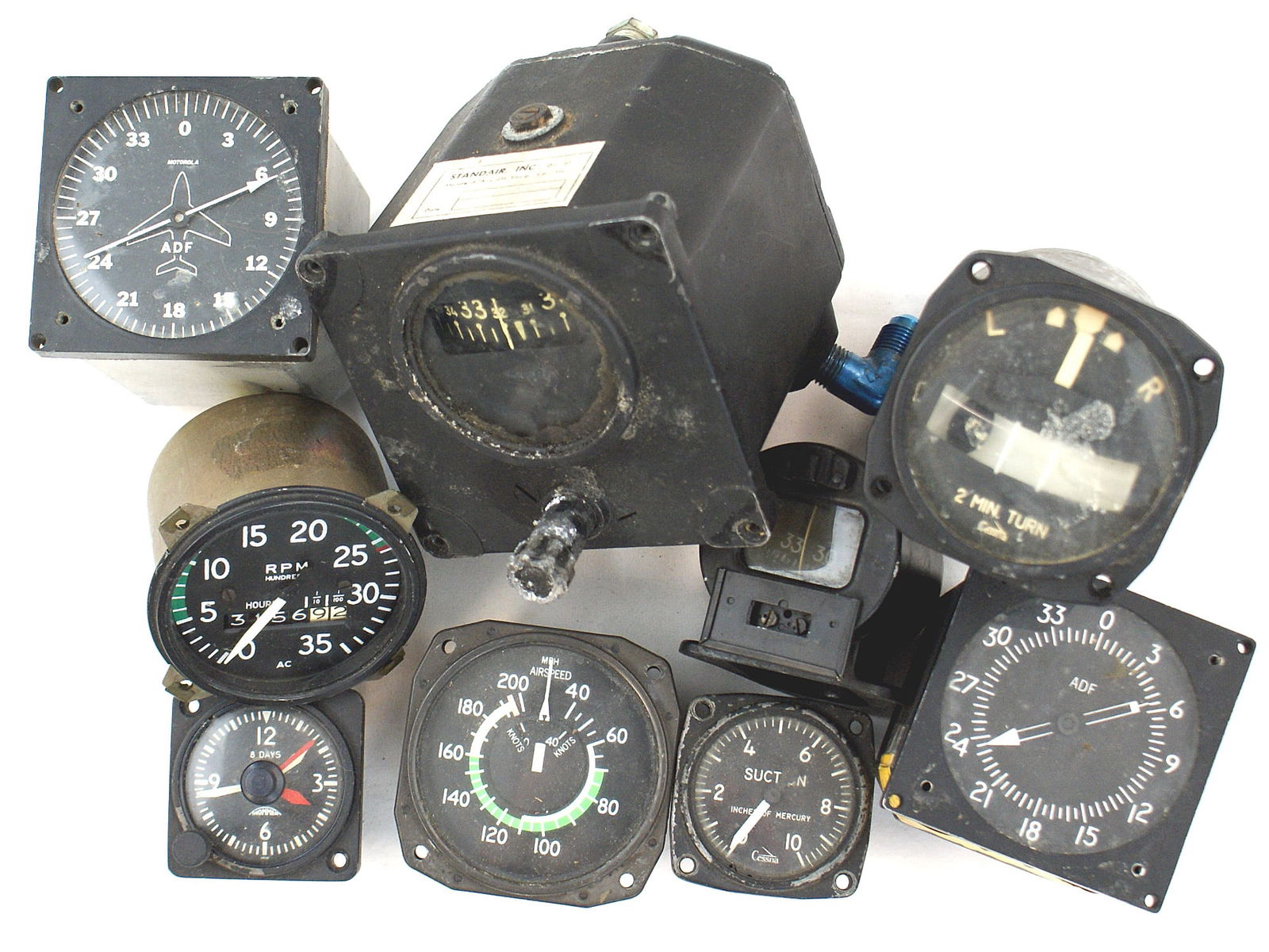 9 US post war airplane instrument gauges GYRO: N-026 Lot of 9 American Post-war airplane instrument gauges. Includes a "DIRECTIONAL GYRO INDICATOR", "8 DAYS" clock, "RPM HUNDREDS" gauge, 3 Cessna gauges ("AIRSPEED", ELECTRIC TURN & BANK INDICATOR"