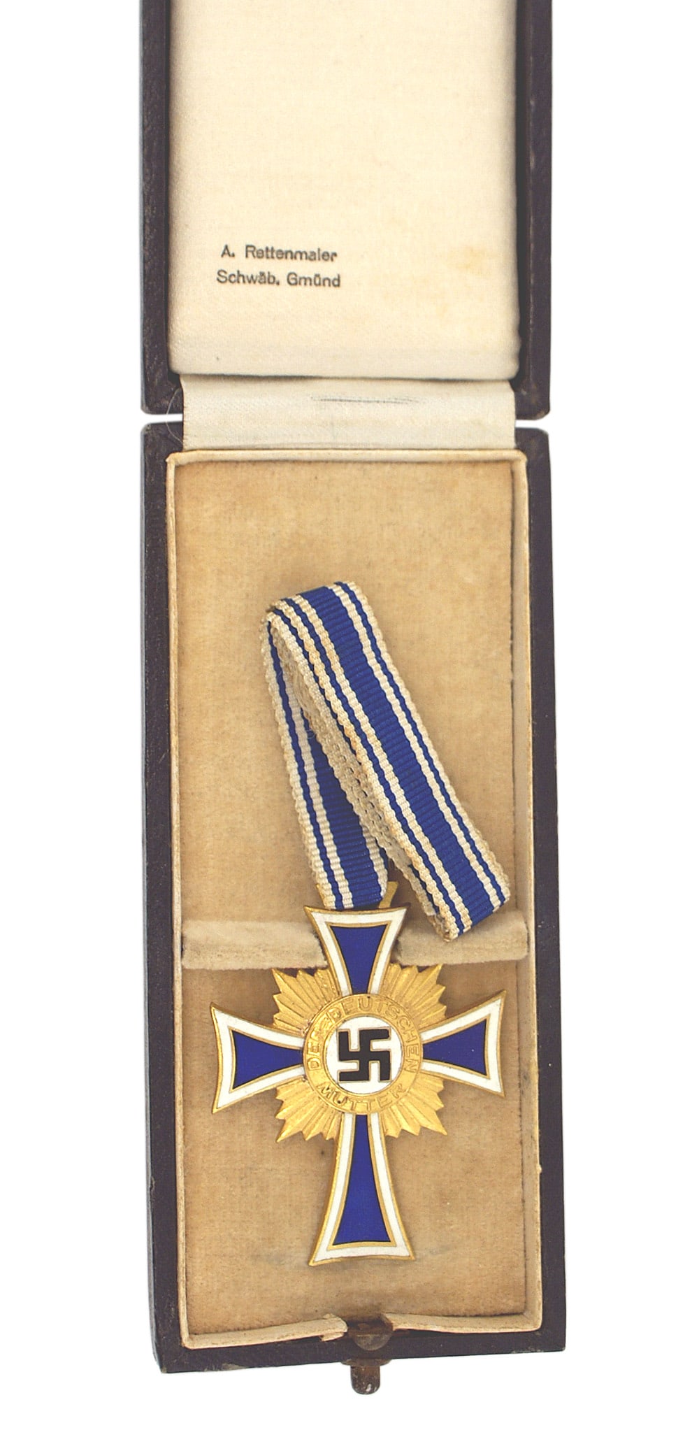 German WWII Mothers Cross Gold: B-019 Mother's Cross - Gold. Black enameled swastika on a white field surrounded by "DER DEUTSCHEN MUTTER" on a gilt starburst background and a white outlined blue enameled cross. Reverse has date of 