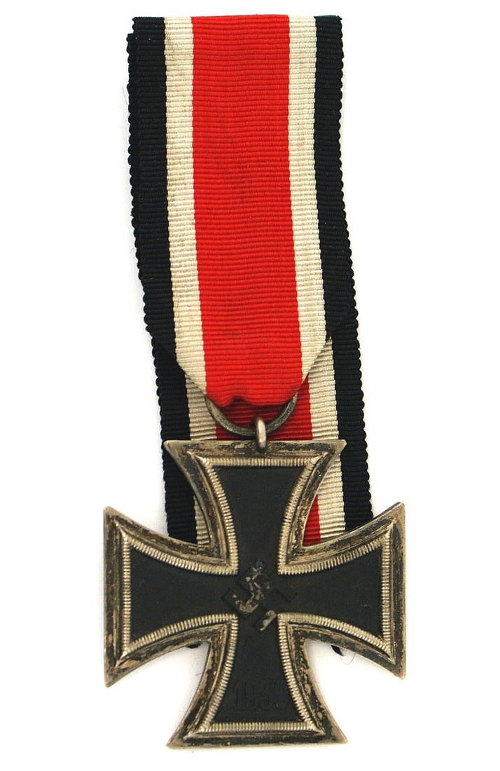 German WWII Iron Cross 2nd Class: B-030 German WWII Iron Cross 2nd Class. Some of the black finish is worn on the swastika. "1939" on obverse, "1813" on reverse. Purplish patina on the silvered frame. Unissued double ribbon length. Ri