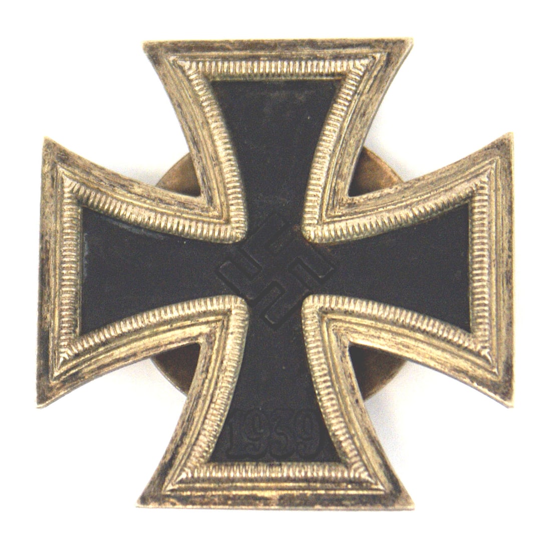 German WWII 1st Class Iron Cross: B-033 German WWII 1st Class Iron Cross. Black obverse with a swastika and "1939". Post on reverse with a screw in domed "spinner". Marked in relief "L/21" ("Brothers Godet & Co. in Berlin"). II