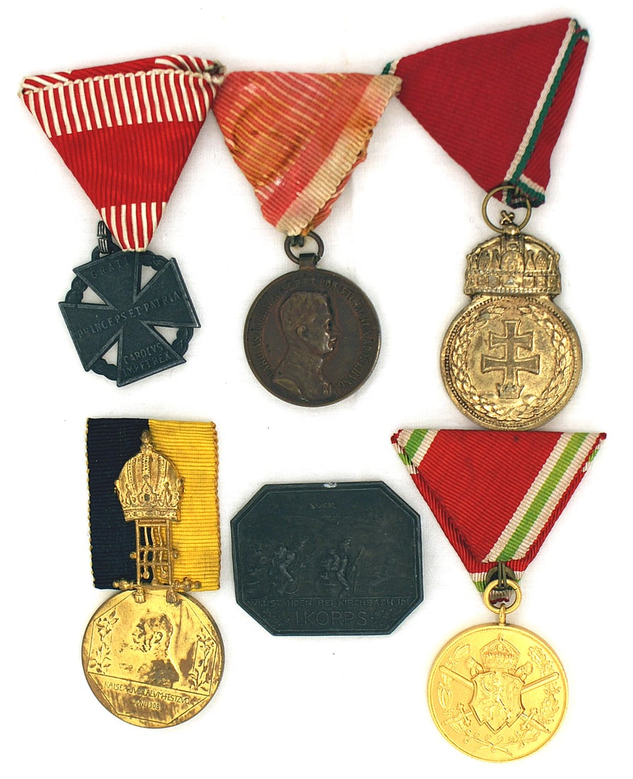 Austrian Medals St. Stephens Karl Troop Cross WWI: B-081 Lot of Austrian Medals. Includes: (1) Hungarian St. Stephens Crown on an Austrian triangle ribbon. (2) Karl Troop Cross WWI. (3) Unknown. Gilt profile of Franz Joseph, June 1908. Reverse knight 