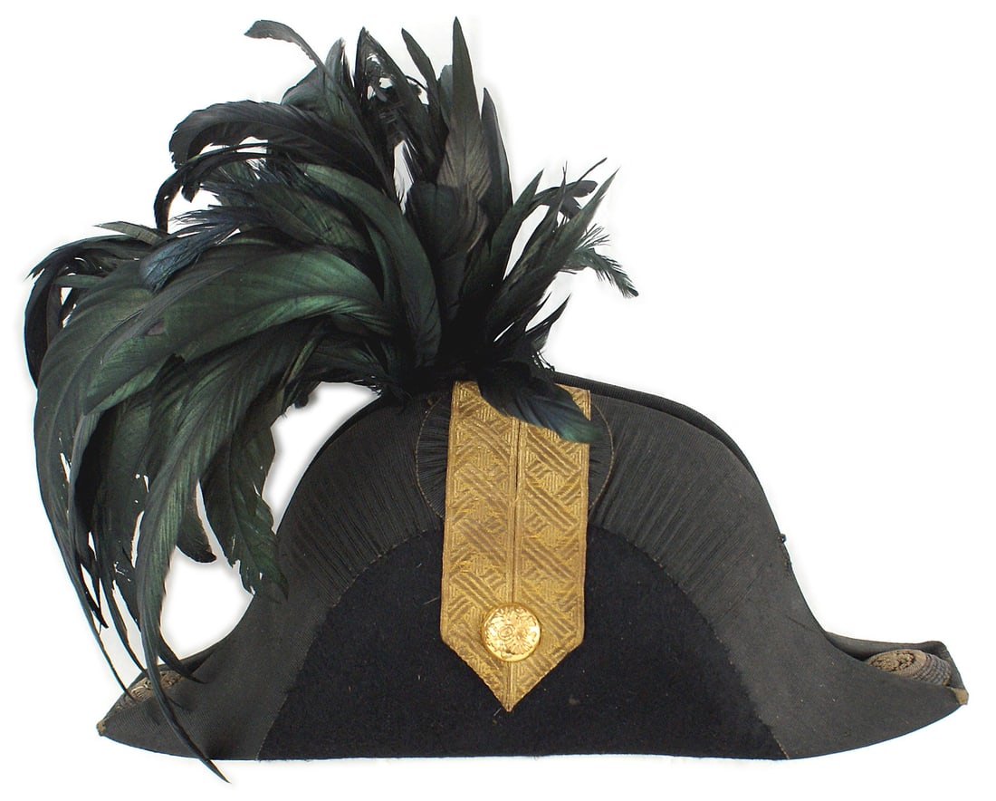 Austrian M1892 Colonel fore aft cap: E-001 Imperial Austrian M1892 Colonel Staff Officer fore & aft cap. Quality black felt body, with a 2 1/4" wide "wrinkled" black silk ribbon perimeter. 5 1/4" x 2 1/8" designed gold tress "epaulette"