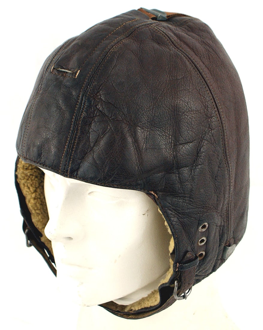 German WWII Luftwaffe pilot helmet: E-017 German WWII Luftwaffe pilot's brown leather helmet. With snap/straps and buckles/chinstraps. Sheepskin lining and chamois forehead lining. II