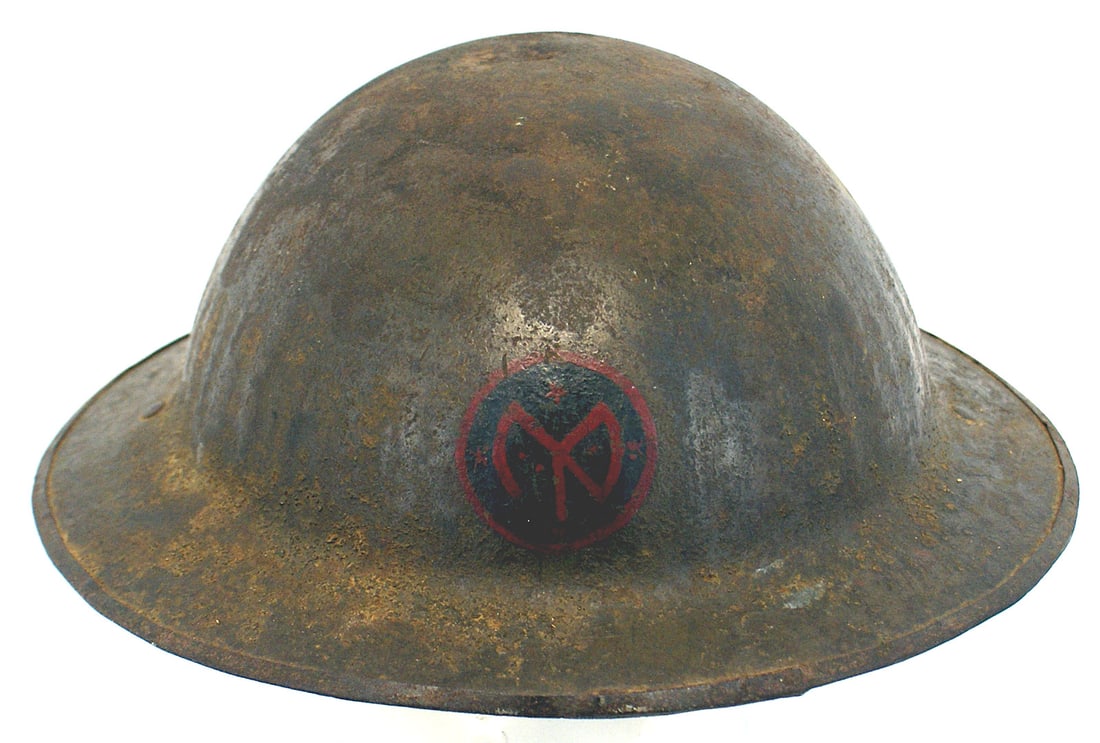 US WWI NY 27th Division doughboy helmet shell: E-037 U.S. WWI New York State 27th Division "doughboy" helmet shell, only. Approximately 15% of the Sand finish adhering to the well worn, possibly bullet creased, darkened body. Red on black painted 