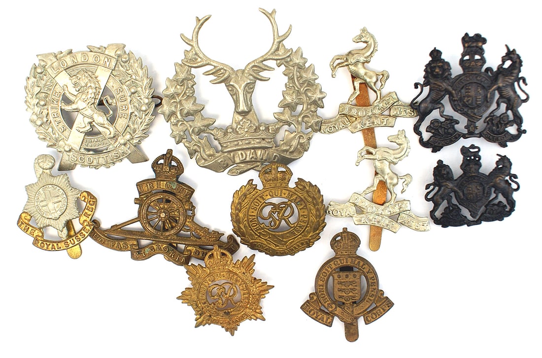 Lot of 11 British cap badges Scottish 10th Gordon: E-073 Lot of 11 British cap badges. Includes: (1) Scottish 10th Regiment, "THE ROYAL SUSSEX REGT." "ROYAL ENGINEERS", "ROYAL ARMY SERVIE CORPS", "ROYAL ARTILLERY" and Gordon Highlanders. II