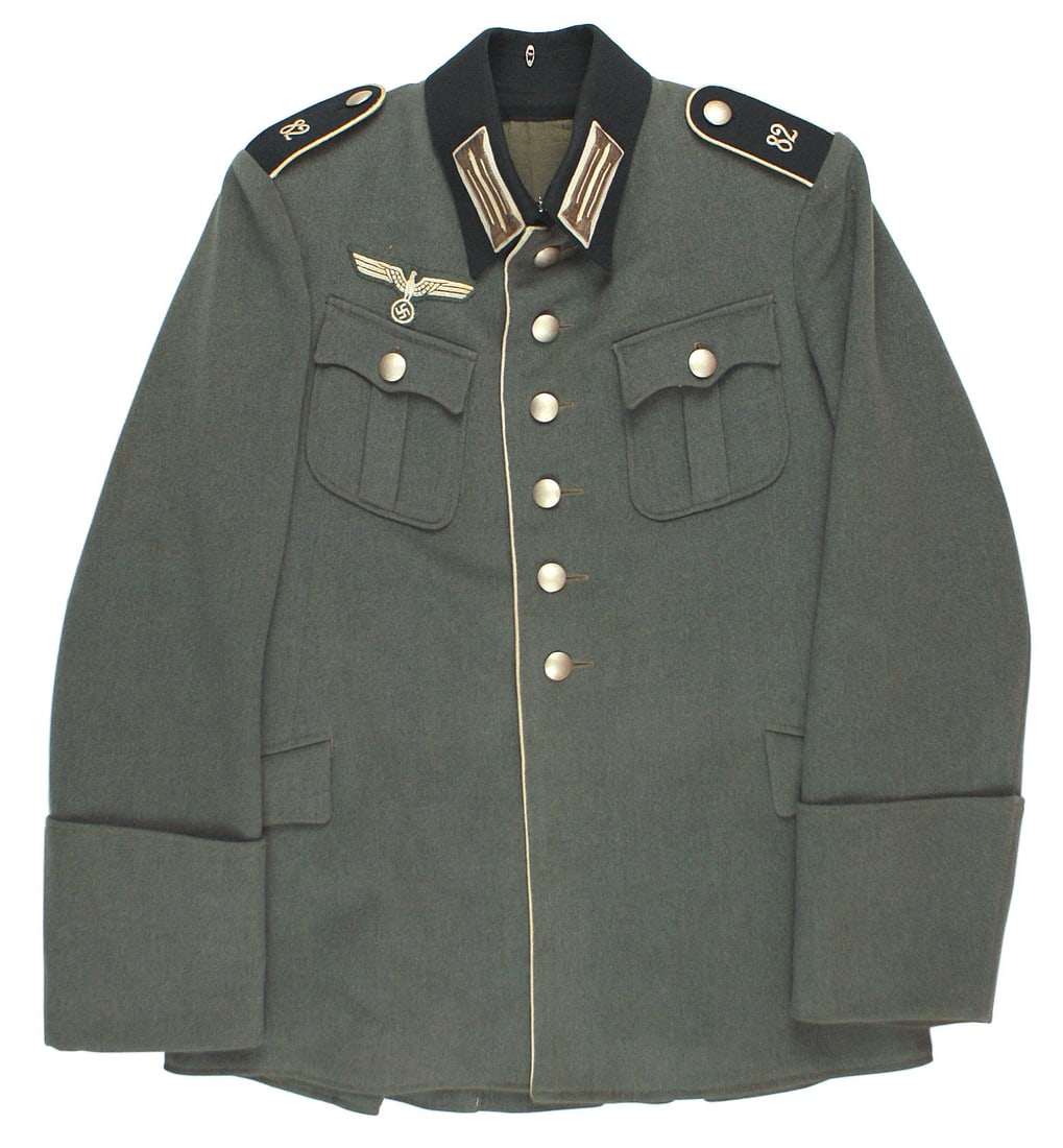 German WWII Infantry 82nd Regiment EM tunic: F-008 Early Third Reich Army Infantry 82nd Regiment enlisted man's tunic. Four pocket, fine quality material with six silver pebbled front buttons. Embroidered white breast eagle/swastika (may be repl