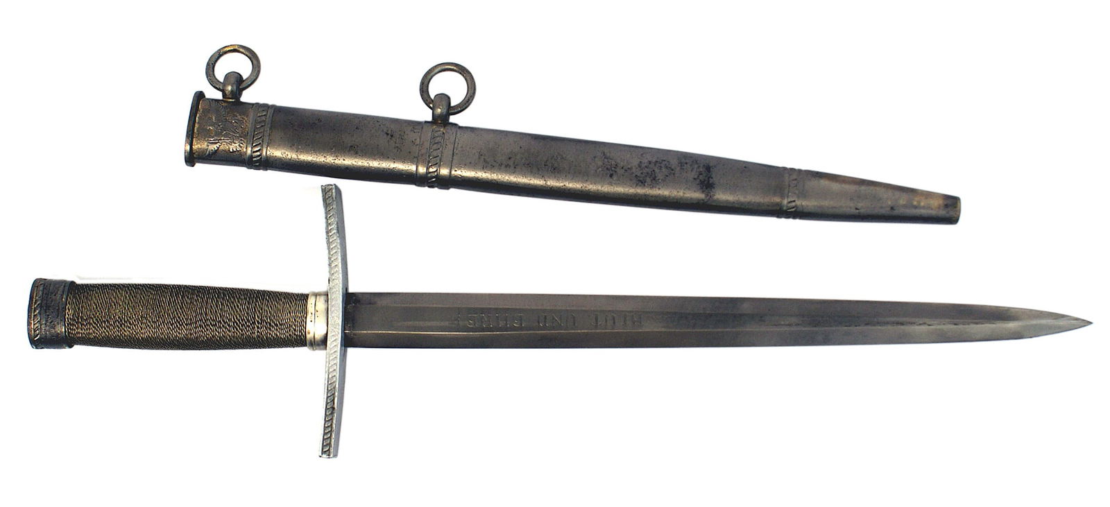 German WWII Youth Corps Leader dagger: D-005 German Third-Reich Youth Corps Leader's dagger. Silver wire wrapped grip. Oval silvered pommel cap with a relief H.J. diamond/swastika top. Flat turned up crossguard with a twisted rope pattern