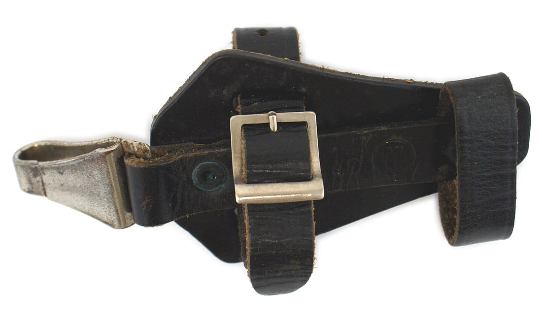 German WWII SS black leather dagger hanger: D-014 German Third-Reich SS black leather vertical dagger hanger. Marked "SS - 1/...6 RZM". With strap/buckle, retaining strap and snap hook marked "M5/25" over "RZM". II