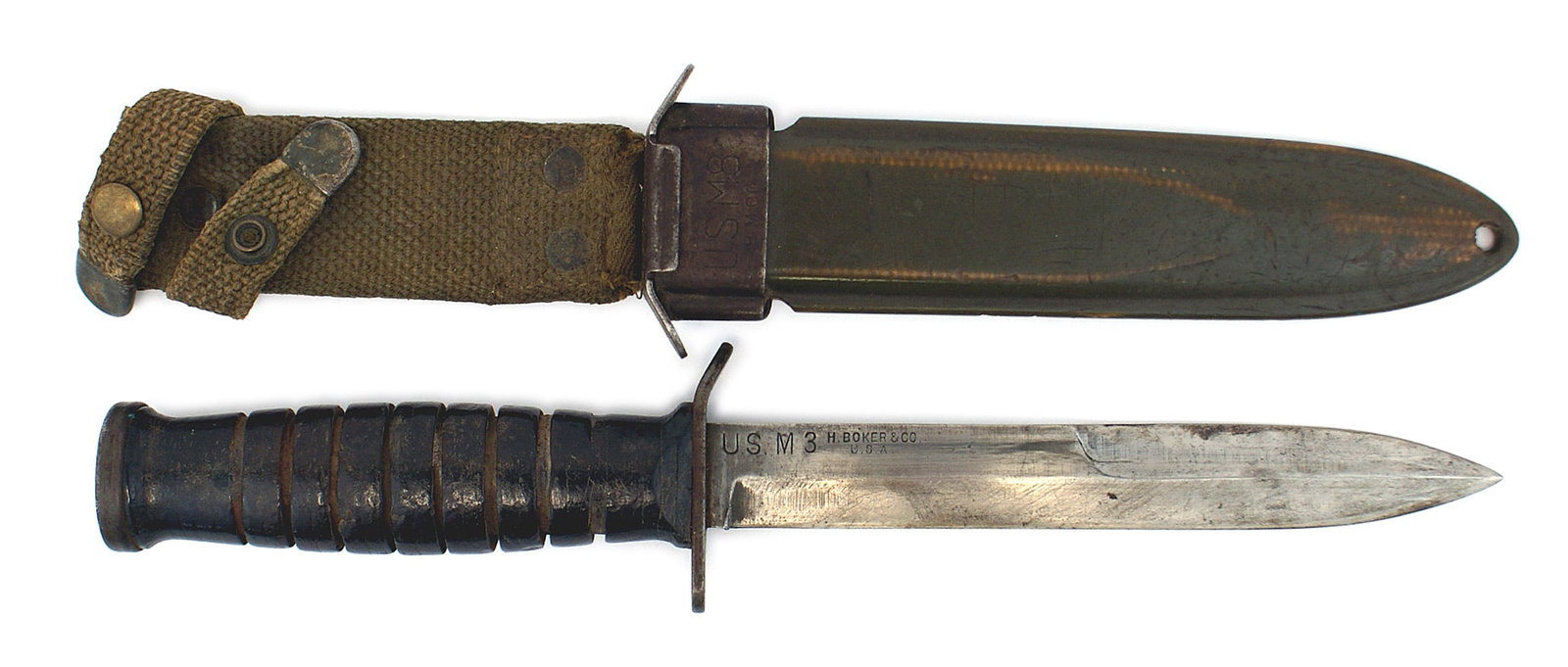 US WWII M3 combat knife: D-044 U.S. M3 combat knife. 6 3/4" blade marked "U.S. M3 - H. Boker & Co. U.S.A." Shows use and finish worn Early M8 scabbard without belt hooks. This knife is rarest of the M3 combat knives. II