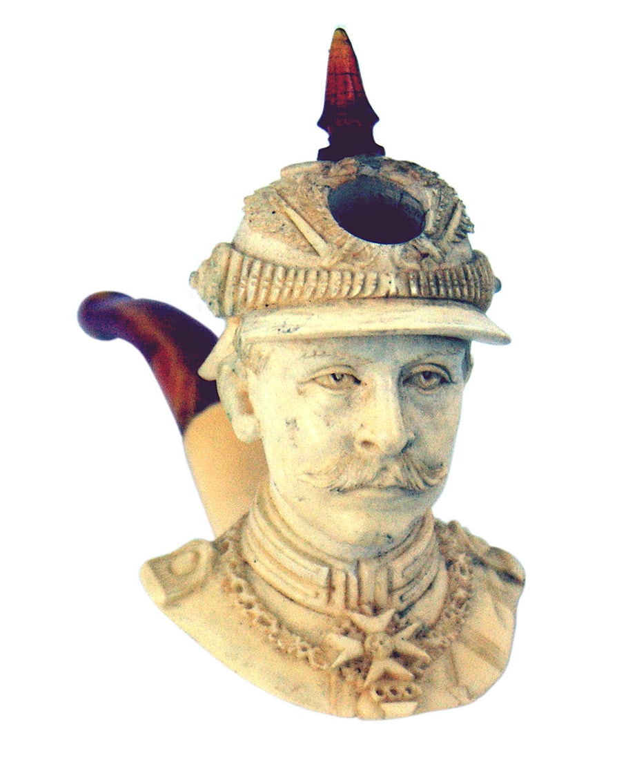 Imperial German Meerschaum pipe Kaiser Wilhelm II: A-003 Imperial German figural Meerschaum pipe. Bowl is a carved detailed likeness of a young Kaiser Wilhelm II wearing a Garde officers spike helmet with an amber spike. Opening in front to accommodat