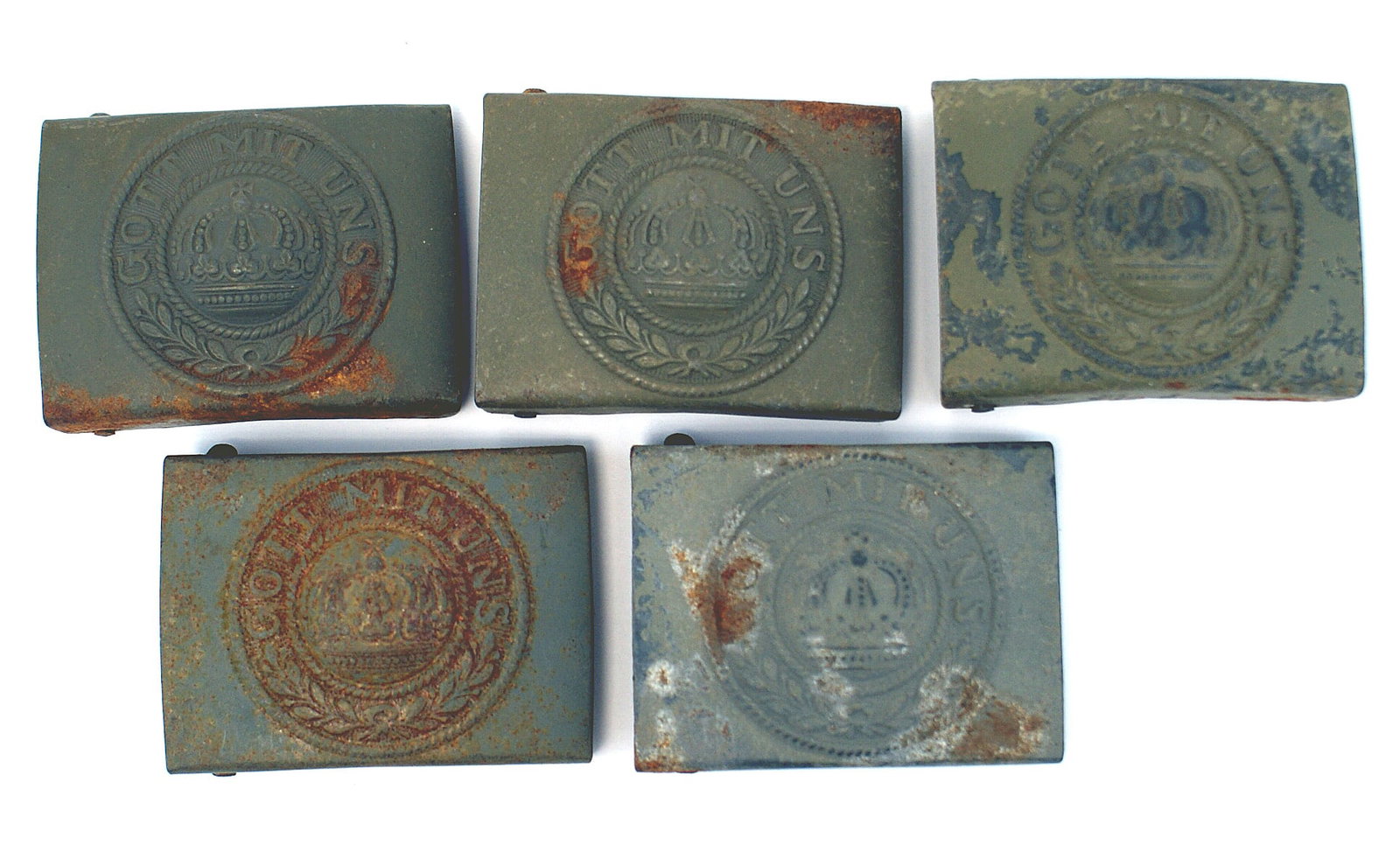 5 German WWI EM belt buckles: H-002 Lot of 5 German WWI E.M. soldier's belt buckles. O.D. finish on the one-piece relief crown, "GOTT MIT UNS" and laurel/oak leaf wreath. Unissued but age has left at least one or two surface rust 