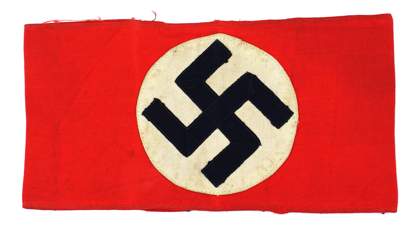 German WWII NSDAP armband: H-011 Third-Reich N.S.D.A.P. armband. Three-piece construction. Period added 1 1/2" wide section of the matching red cloth to reverse, increasing the arm size. Was removed from a garment (still retain