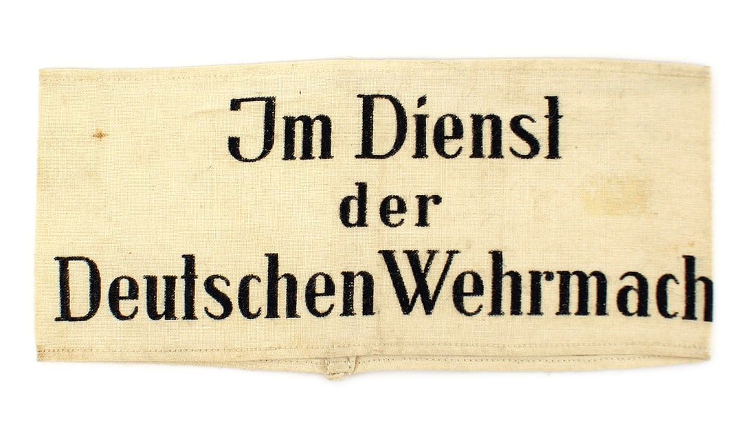 German WWII armband Im Dienst der Wehrmacht: H-017 German WWII armband "Im Dienst der Wehrmacht" (In Service of the German Armed Forces). Black printing on a white field. II