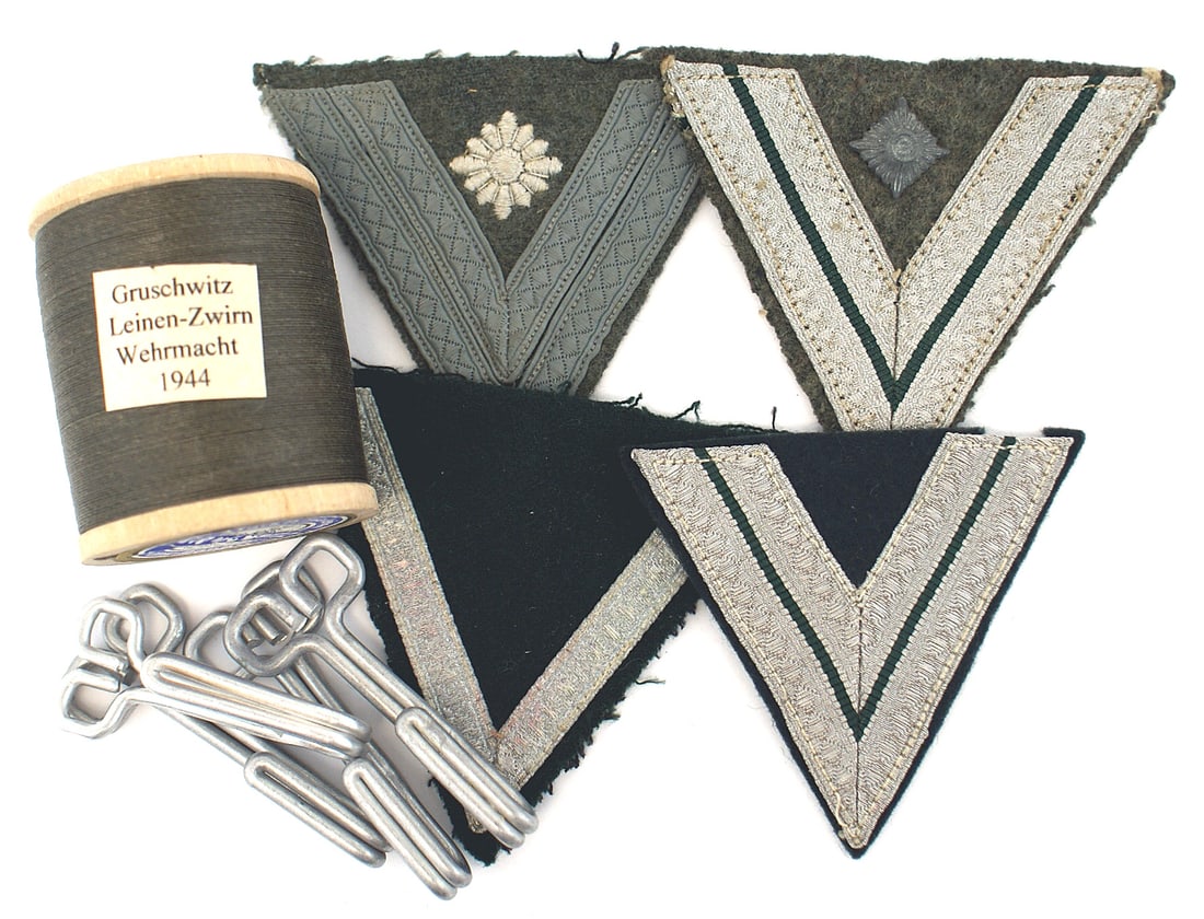 German WWII lot. Includes chevrons belt hooks thread: H-039 Miscellaneous German WWII lot. Includes: (1) Four different Army rank chevrons. (2) Four unissued Army belt hooks. (3) Unused spool of Army OD thread. Makers label "GRUSCHWITZ" and dated "24.3.4