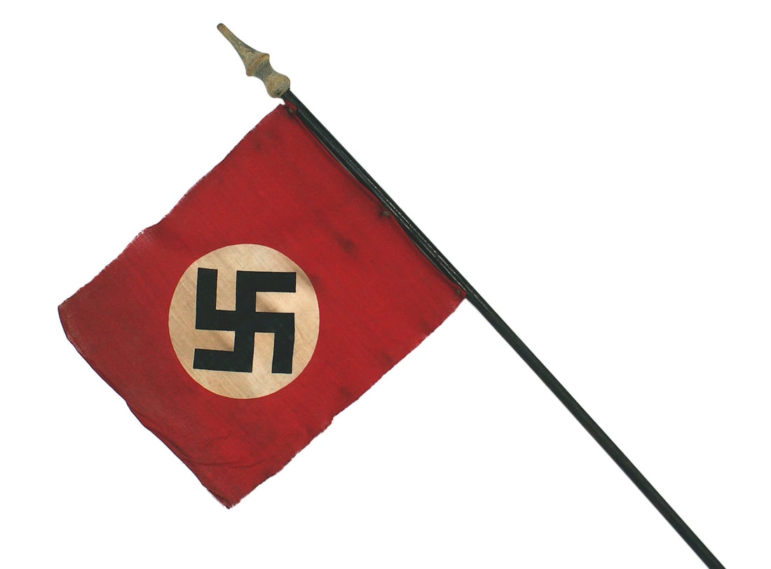 German WWII NSDAP parade flag: H-042 N.S.D.A.P. parade flag. Printed 7 1/2" x 8 3/4" N.S.D.A.P. cloth flag, attached to a 25" hand held pole with a wood finial. II