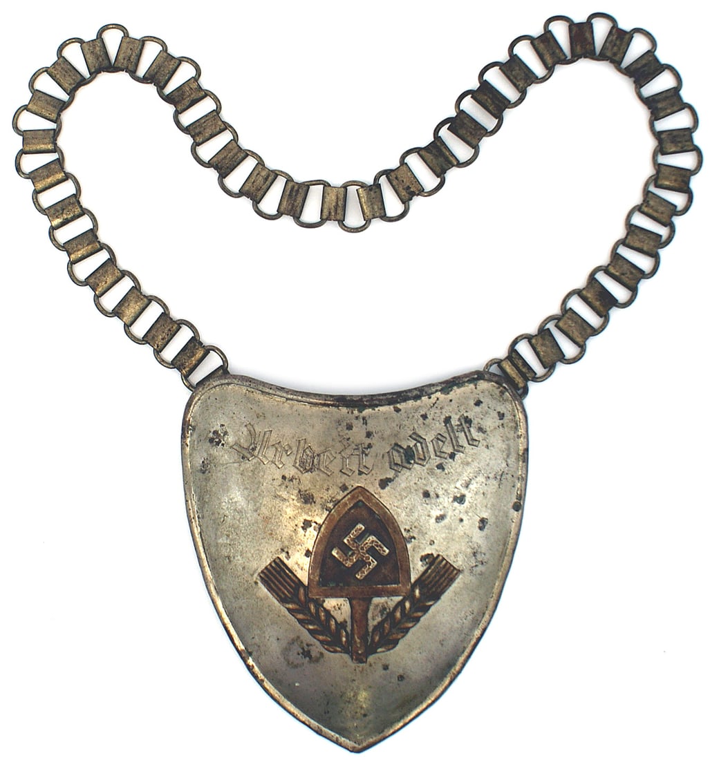 German WWII RAD Labor Service flag bearer gorget: H-055 German Third-Reich "Reichsarbeitsdienst" (National Labor Service) flag bearer gorget. Nickeled heart shaped metal shield with an affixed RAD emblem (5 1/8" x 5" shovel/swastika between stalks of