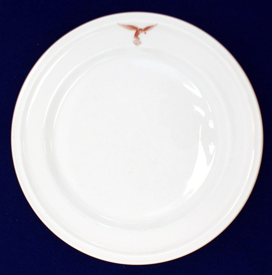 German WWII Luftwaffe porcelain plate: H-062 Third-Reich Luftwaffe officers, mess hall, quality porcelain dinner plate. Auburn flying eagle/swastika on rim. 9 1/2" diameter. Reverse marked "Rosenthal" with logo. From the Donald G. Brownlow