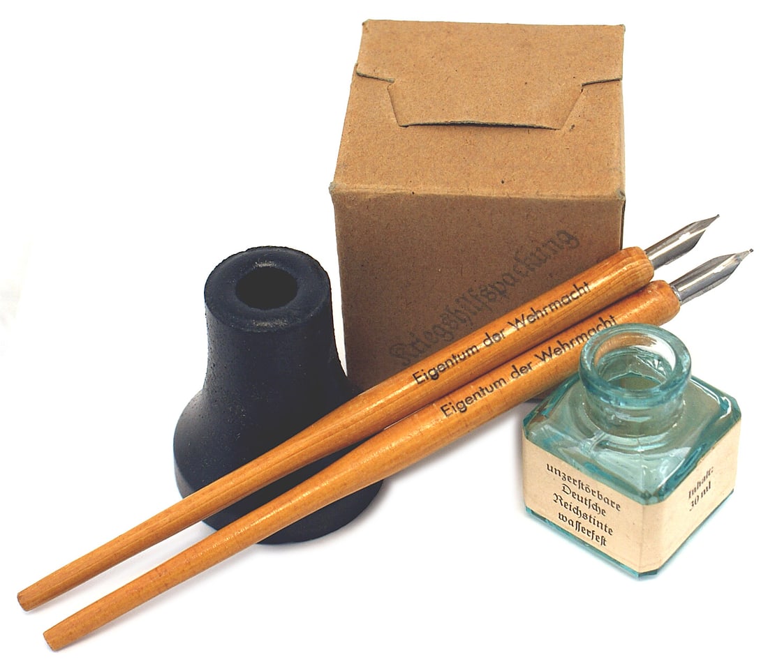 German WWII military desk implements ink well: H-080 German Third-Reich military desk implements: (1) Glass ink well with eagle/swastika, "Reichstinte...". (2) Ceramic cylinder-shaped ink well. Base marked with a eagle/swastika and "Wr. A. 343". W