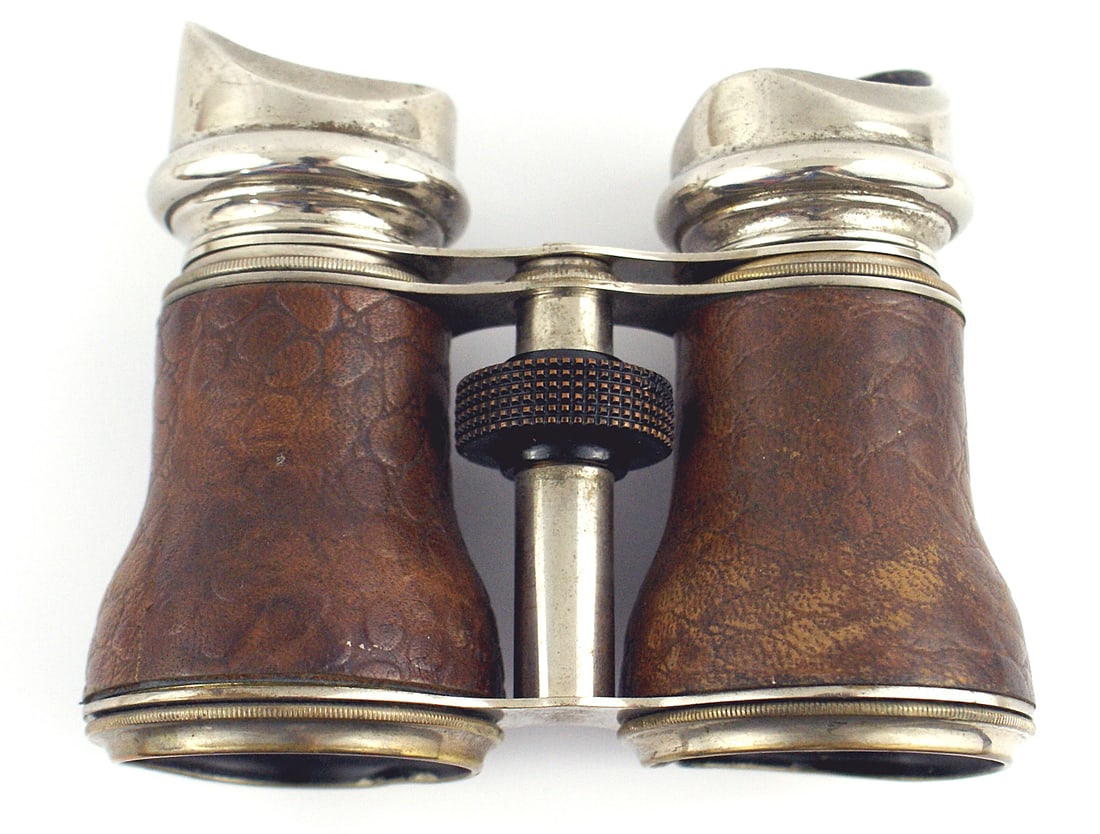 Antique binoculars probably French Circa 1910: H-119 Antique binoculars. Quality, probably French, private purchase with leather wrapping and chromed eye pieces, frame and lens rims (slight dent) marked "VERRES". Circa 1910. From the Donald G. Bro