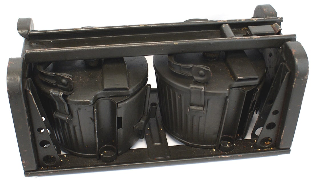 2 German WWII MG34 basket magazines with case: M-007 Lot of 2 German WWII MG 34 "basket" magazines. Both with folding handles. Also with issue metal frame carrier. Were repainted some time ago. II