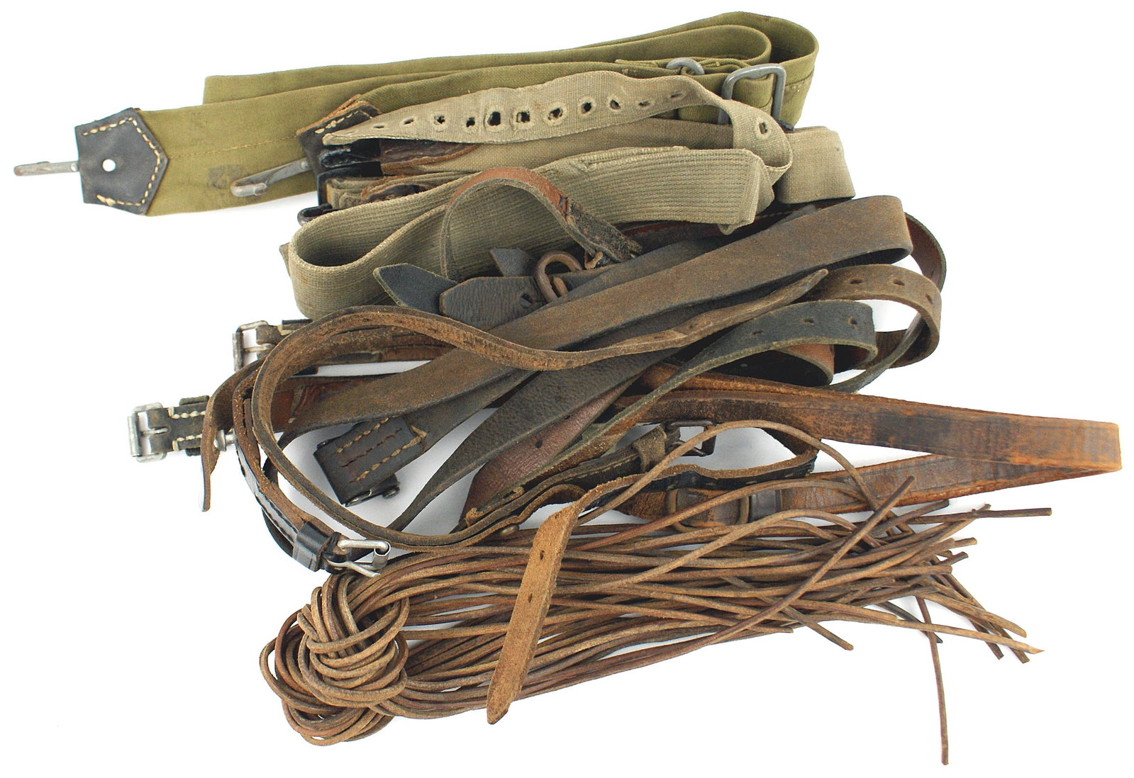 German WWII straps Schmeisser sling cross strap: N-007 German WWII miscellaneous straps: (1) Schmeisser sling. Marked "MP 38 u. 40". Shows wear. (2) Under tunic cross strap. (3) Army and Navy bread bag shoulder straps. (4) Short cross strap. (5) Six