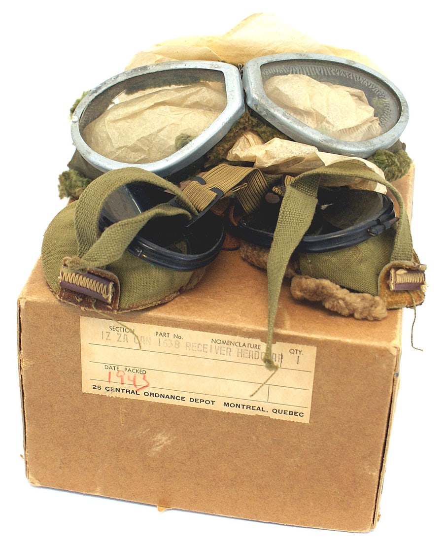 2 Canadian WWII Military goggles: N-016 Lot of 2 Canadian WWII Military goggles. Both have spring mounted frames. With soft edge cushioning and an OD elastized strap. One set of lenses is clear and the other is tinted. With a "1943" l