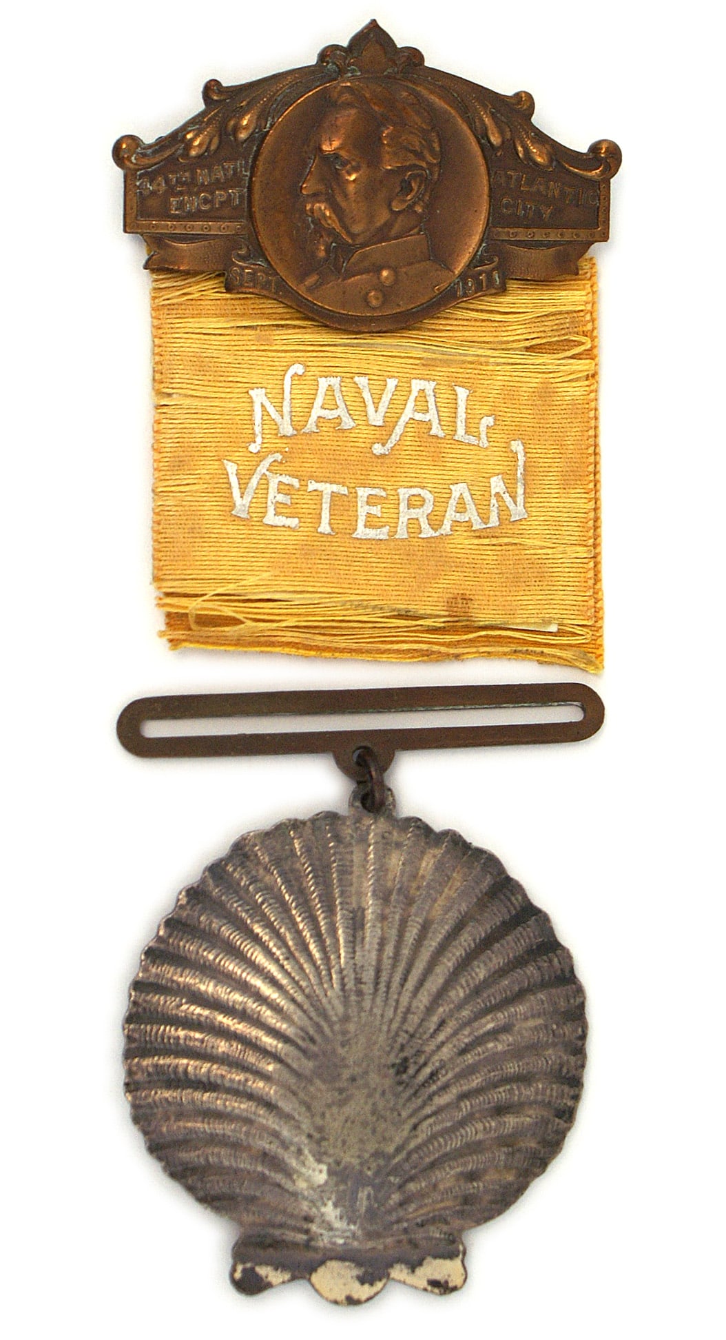 Civil War Navy GAR 44th National Encampment Badge: K-014 Composite U.S. Civil War Navy Veterans 44th National Encampment Badge. Bronze pin-back pendant with a portrait and "44th NAT'L ENCPT - ATLANTIC CITY - SEPT 1910". Yellow-gold worn ribbon with si