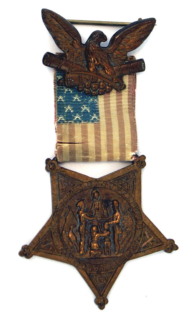 Civil War GAR Badge Type III 1869 - 1876: K-019 U.S. Grand Army of the Republic (GAR) Badge, Type III - 1869-1876. Five-pointed bronze star with a center scene of the Goddess of Liberty, a soldier and sailor, flags, etc. Reverse has the Natio