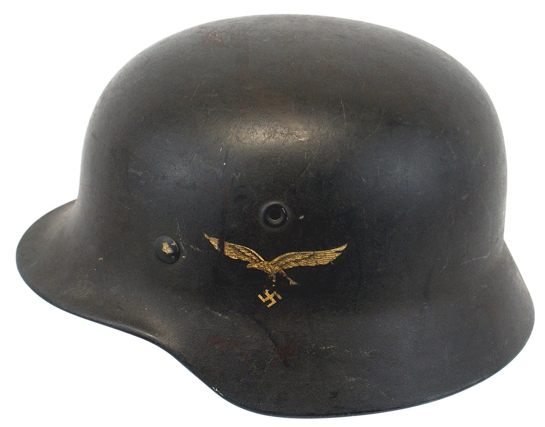 German WWII Luftwaffe M1940 single decal helmet: E-028 German WWII Luftwaffe M1940 single decal helmet. Some expected wear to the dark-blue finish. Eagle decal shows some scratches to the right wing and tail. Original chinstrap shows wear as does th