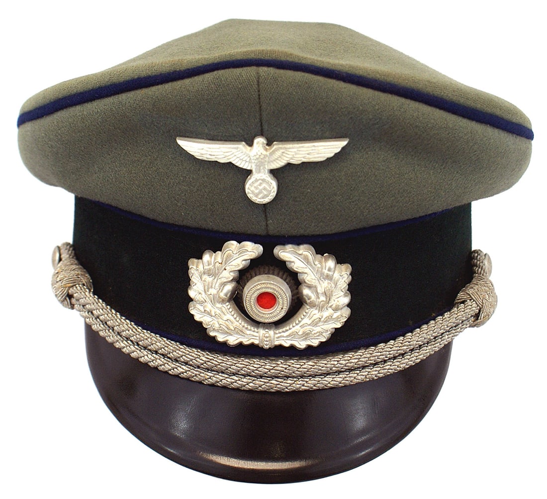 German WWII Army Medical peaked cap: E-043 German WWII Army Medical officer peaked cap. Quality doeskin with a dark green band and cornflower blue piping. Silver metal eagle/swastika and wreath/rosette. Silver chin cord. Black vulcan vis