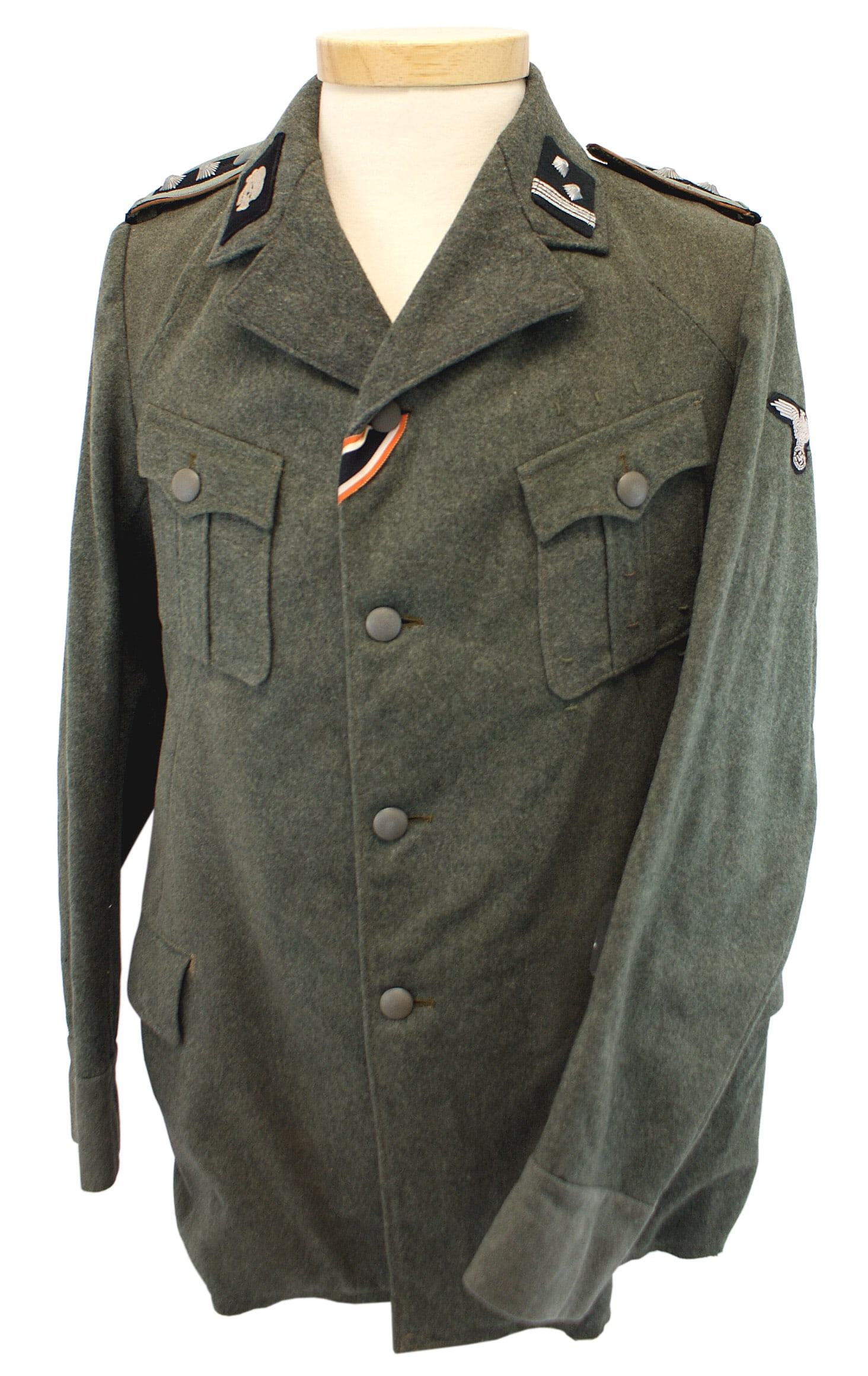 German WWII SS Totenkopfverbande tunic: F-006 German WWII SS - Totenkopfverbande tunic. Wartime "ersatz" wool, four pocket, open collar tunic. Embroidered relief "Totenkopf" (skull) and "SS - Sturmscharfuhrer", machine sewn collar tabs. Sli