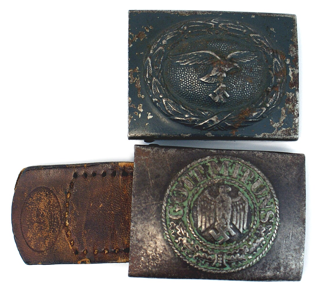 2 German WWII belt buckles Army Luftwaffe: H-005 Lot of 2 German WWII belt buckles: (1) Army E.M. - steel. Relief eagle/swastika in center of a wreath with "GOTT MIT UNS" and oak leaves. Green paint residue between lettering. Maker's name and 