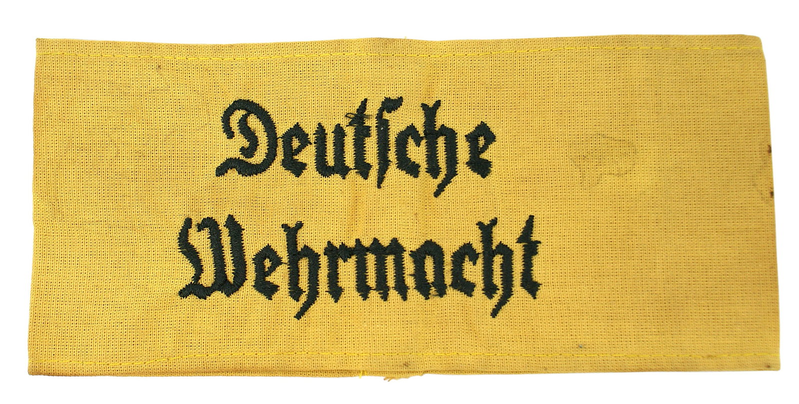 German WWII Armed Forces armband: H-009 German WWII Army "Deutsche Wehrmacht" (German Armed Forces) armband. Black embroidered lettering on a dull gold cloth band. II