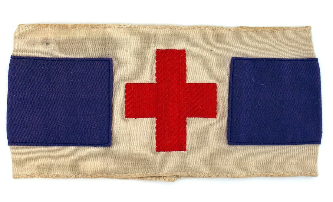 German WWII Catholic Chaplin field armband: H-011 German WWII Catholic Chaplin's field armband. 3 1/2" white band with a 2" wide center purple panel sewn across the reverse and extending 2 3/8" around to the front on each side. The 2 5/8" betwe