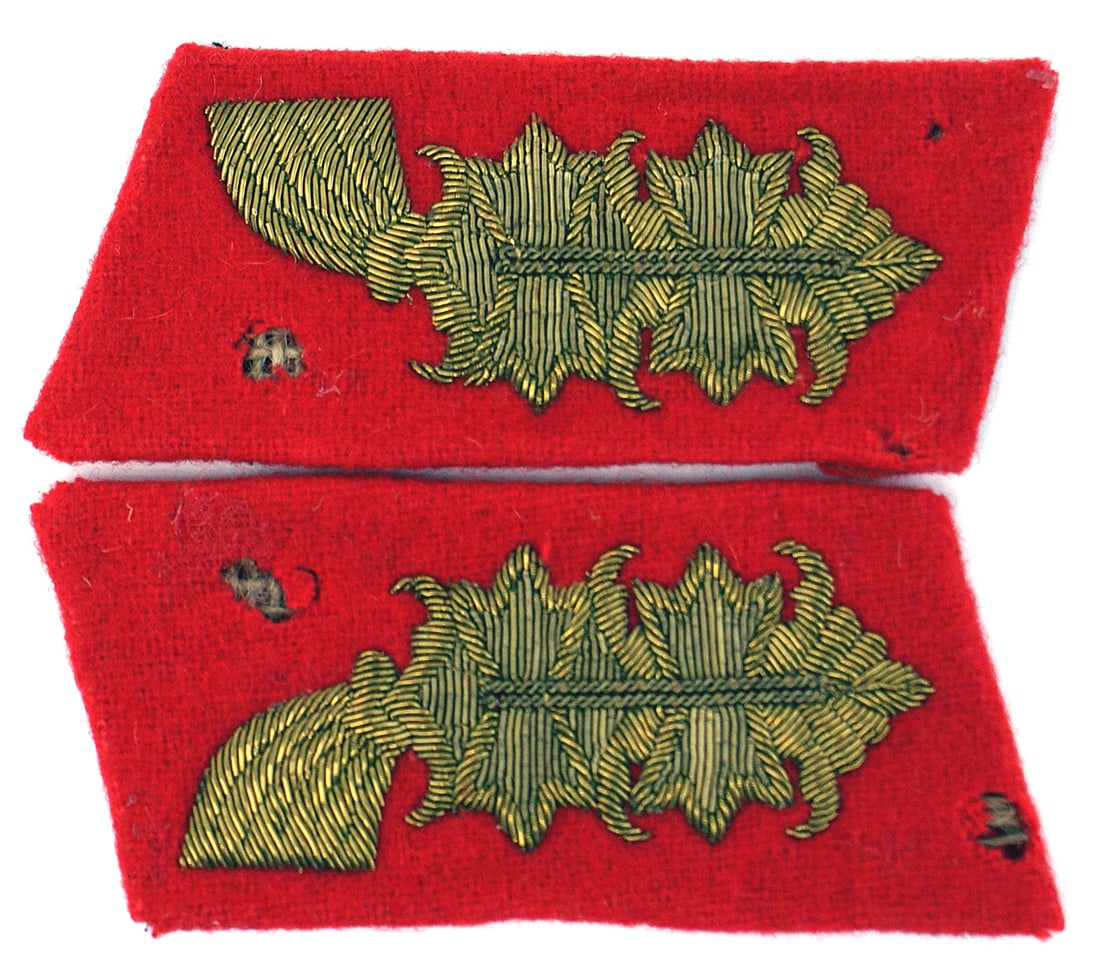 German WWII Army General collar tabs: H-033 German WWII Army General's collar tabs. Embroidered high relief gold bullion acanthus leaves on a red field. Each tab has two moth spots. Scarce. About II